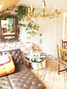 Brown Leather Bed Near Table and Dining Set thumbnail