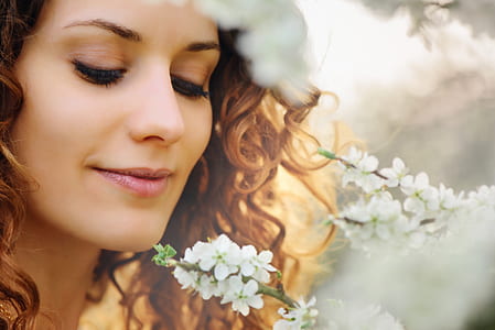 women's brown curl hair and white petaled flowers thumbnail