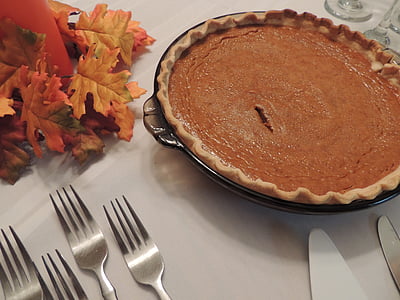 pie cake on glass bowl near forks on table thumbnail
