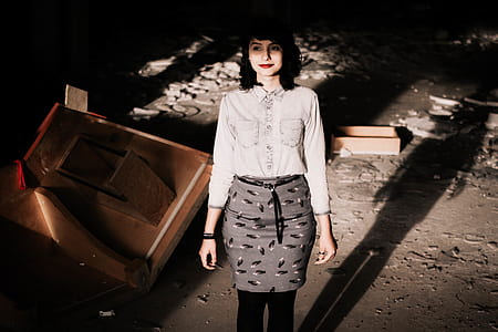 woman standing near brown wooden table thumbnail