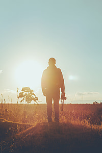 man holding camera thumbnail