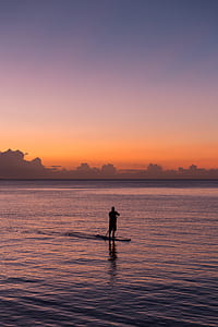 silhouette of person rowing boat thumbnail