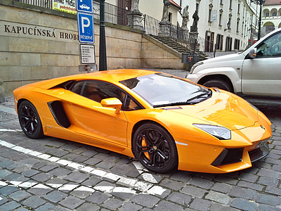 orange Lamborghini Aventador coupe on parking lot thumbnail