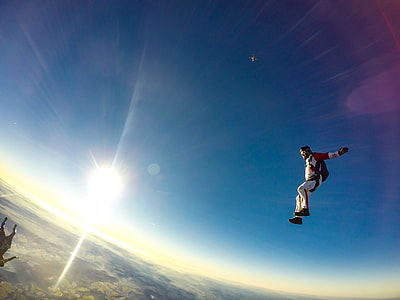 time lapse photo of skydiver during daytime thumbnail