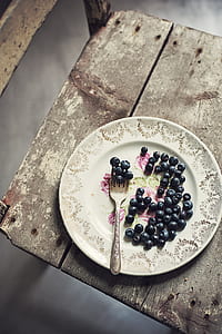 blackberries on white and gray floral ceramic plate and fork thumbnail