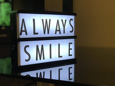 shallow focus photography of always smile signage thumbnail