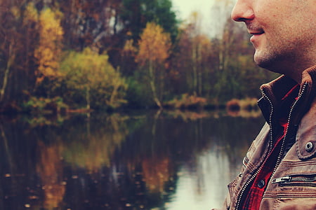 man in brown zip-up jacket thumbnail