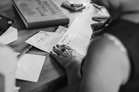 person writing letter grayscale photo thumbnail