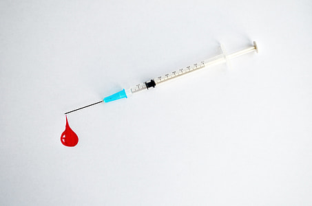 syringe on white surface thumbnail