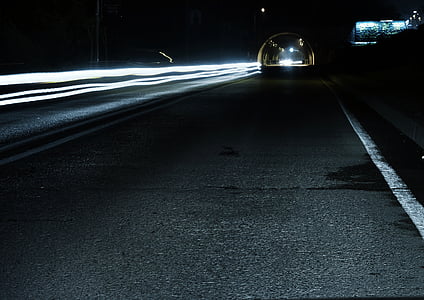 timelapse photography of vehicles traveling on road at nighttime thumbnail