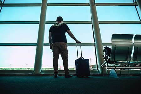 Man Holding Luggage Bag thumbnail