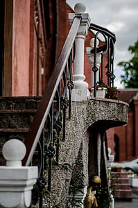 shallow focus photography of brown and black wooden handrail thumbnail