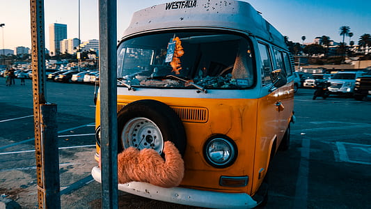 white and orange bus parked at parking space thumbnail