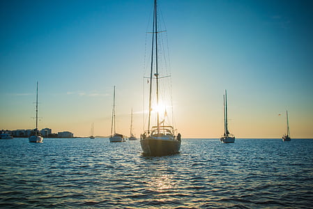 boats on calm sea thumbnail