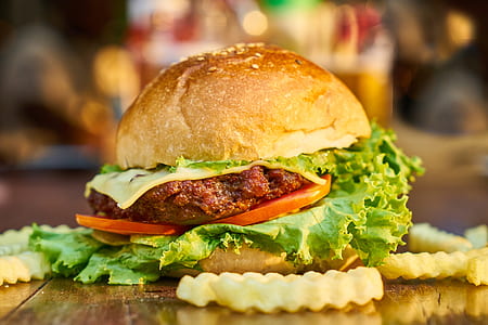 hamburger on brown wooden table thumbnail
