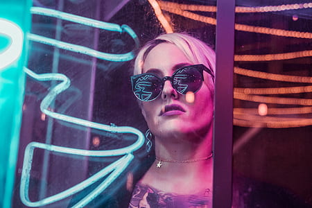 photo of woman standing near glass wall thumbnail