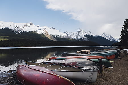 canoe boats near body of water thumbnail