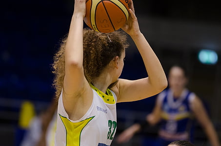woman holding basketball thumbnail