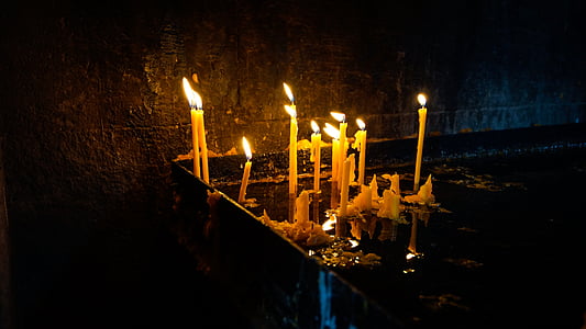 assorted lighted candles at night time thumbnail