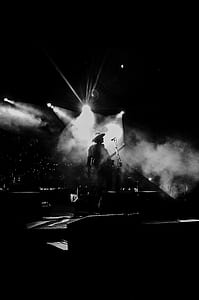 person playing guitar on stage thumbnail