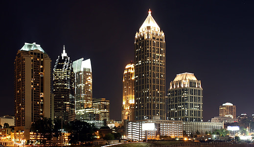 architectural photography of lighted high rise buildings during nighttime thumbnail