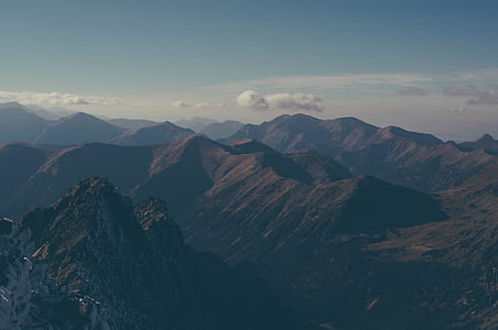 landscape photography of mountains under clear sky during daytime thumbnail