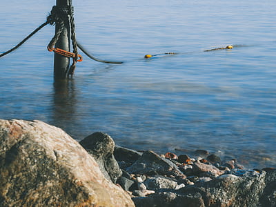 gray and brown stone seashore thumbnail