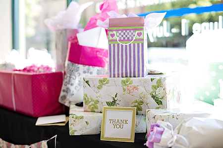 assorted gifts on black textile thumbnail