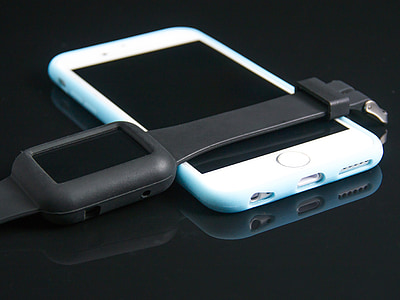 silver iPhone 6 and space gray Apple Watch thumbnail