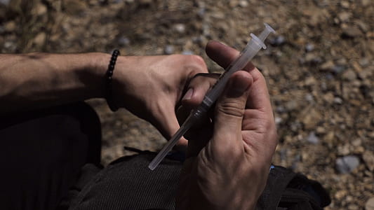person holding syringe thumbnail