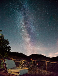 white chaise lounge chair photography under sky thumbnail