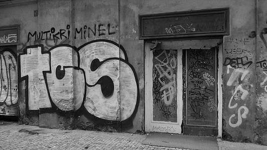 grayscale photography of wall with graffiti thumbnail