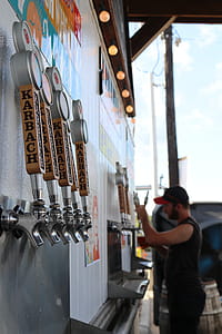 Man Holding Beer Tap thumbnail