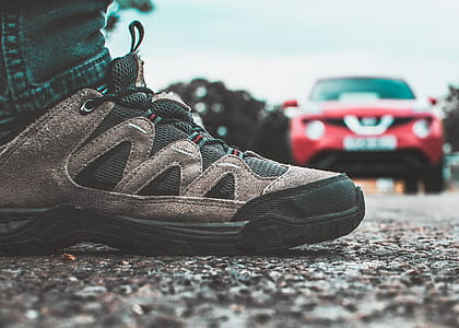 Black and Gray Shoe Near Red Vehicle thumbnail