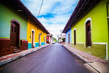 assorted-color concrete houses near street photo thumbnail