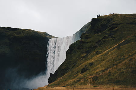 waterfalls raging through mountain thumbnail
