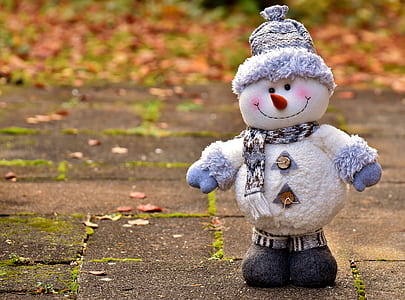 white snowman during daytime thumbnail
