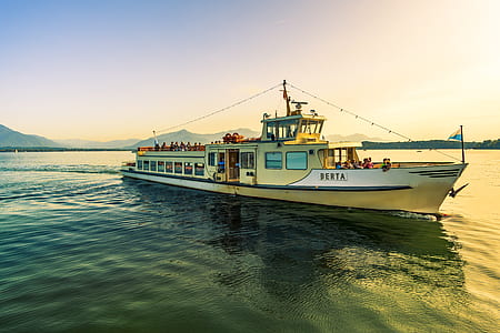 people on yellow boat during golden hour thumbnail
