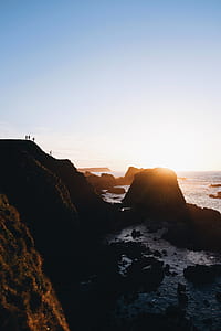 people standing on cliff thumbnail