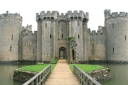 castle near pond body of water under clear sky during daytime thumbnail