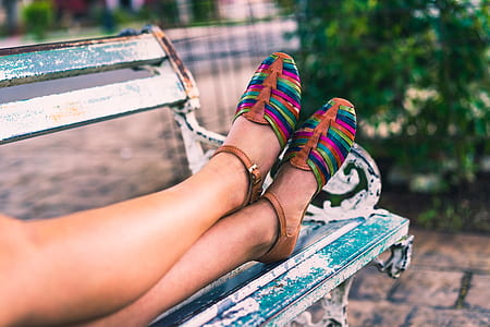 shallow focus photography of woman sitting on bench thumbnail