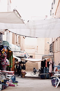 man standing under the canopy of store thumbnail
