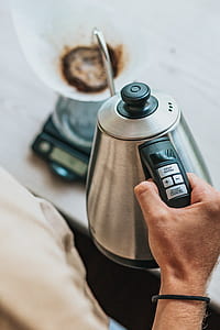 person holding electric kettle thumbnail