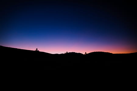 silhouette photo of mountain during golden hour thumbnail