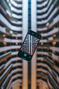 bokeh photography of black Android smartphone thumbnail