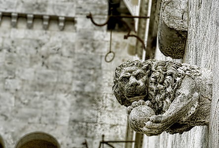 gray concrete wall statue thumbnail