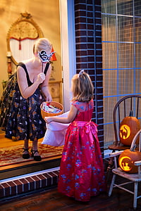 woman wearing dress holding masquarade mask thumbnail