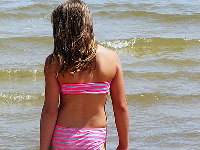 woman wearing gray-and-pink striped bikini during daytime thumbnail