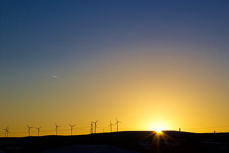 wind mills during sunset thumbnail