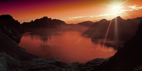 body of water under white sky thumbnail